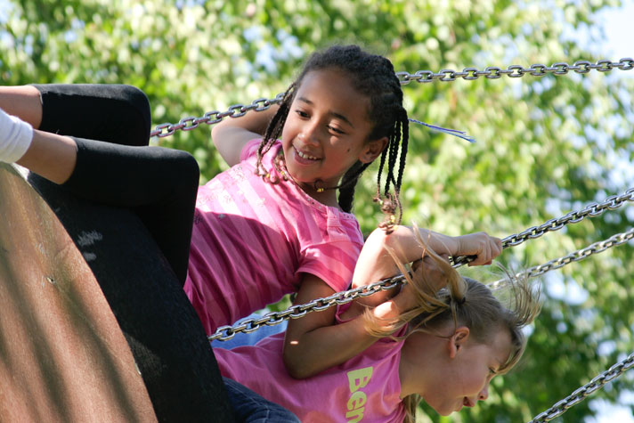 Girls on tyre swing